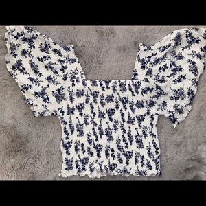 chic blue floral winged blouse.